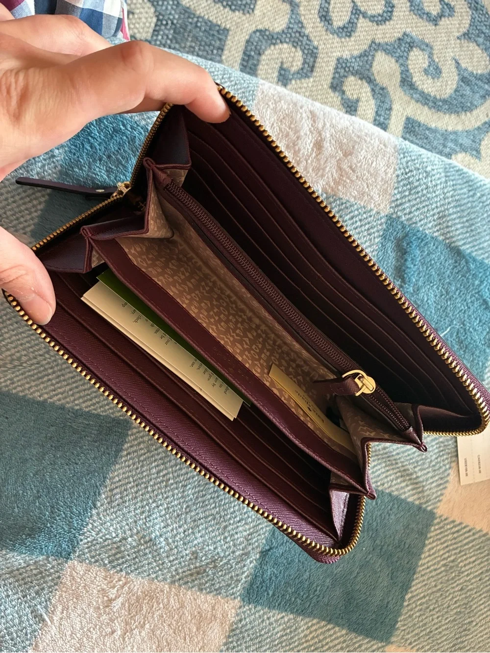 kate spade plum/burgundy zip-around card wallet with gold logo